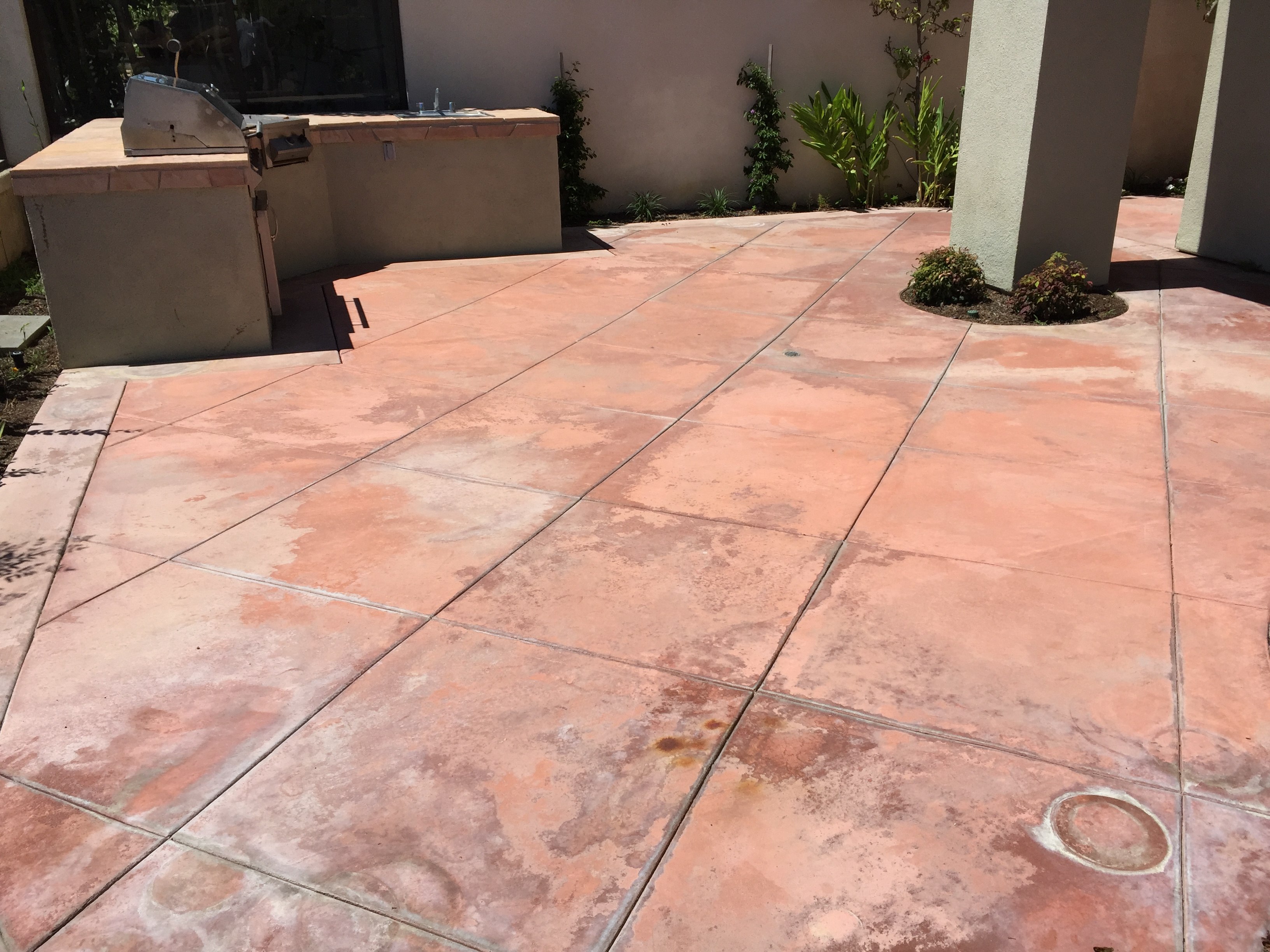 Restore worn concrete patio with waterbased stains